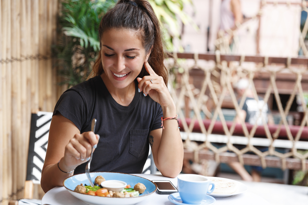 Woman eating healthy foods, managing high or low blood sugar Woman eating healthy foods, managing high or low blood sugar